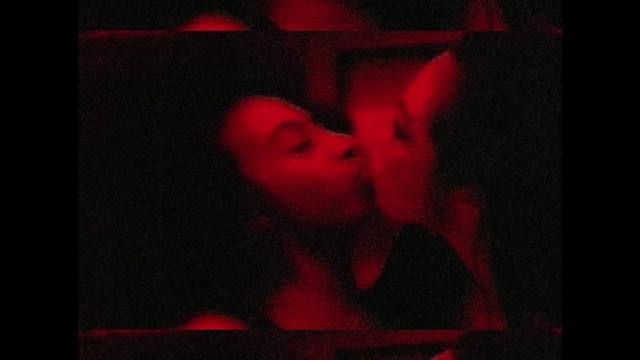 Video Reference: Gesture, Red, Art, Font, Rectangle, Kiss, Flash photography, Magenta, Window, Display device