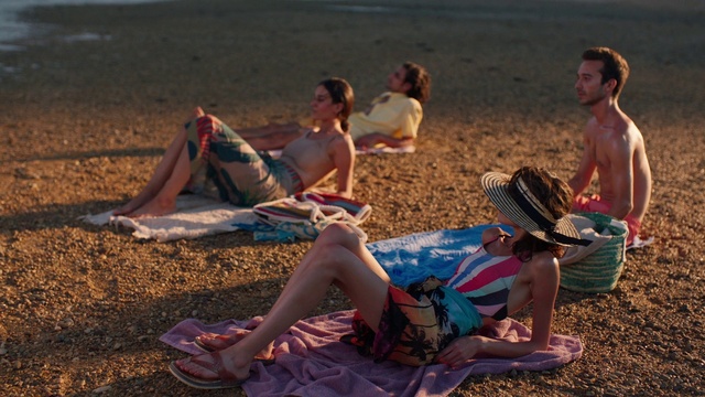 Video Reference: Shorts, Photograph, Leg, Natural environment, People on beach, Beach, Sunlight, Body of water, Swimwear, Leisure