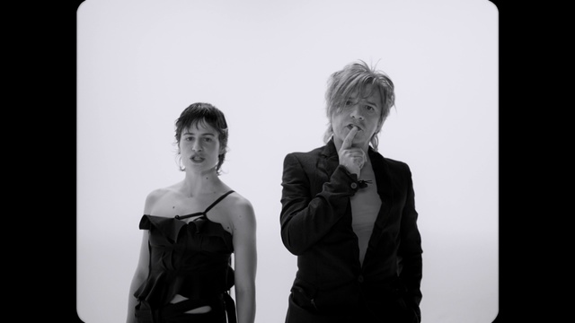Video Reference: Flash photography, Sleeve, Gesture, Black-and-white, Style, Dress, Happy, Blazer, Event, Formal wear