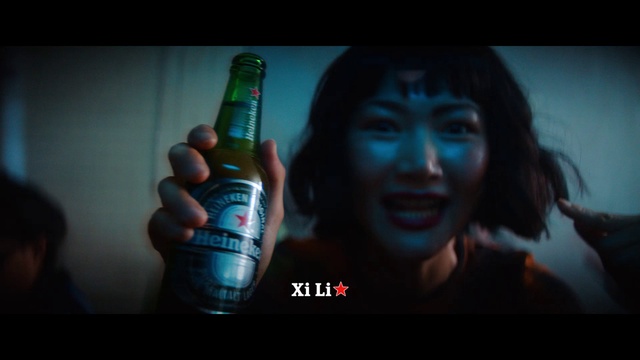 Video Reference: Smile, Flash photography, Bottle, Gesture, Drink, Alcoholic beverage, Beer, Electric blue, Nail, Alcohol