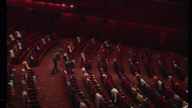 Video Reference: Chair, Musical instrument accessory, Red, Entertainment, Building, Event, Performing arts center, Movie palace, Carmine, Theatre