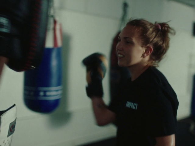 Video Reference: Joint, Shoulder, Gesture, Plastic bottle, Water bottle, T-shirt, Fun, Electric blue, Room, Job