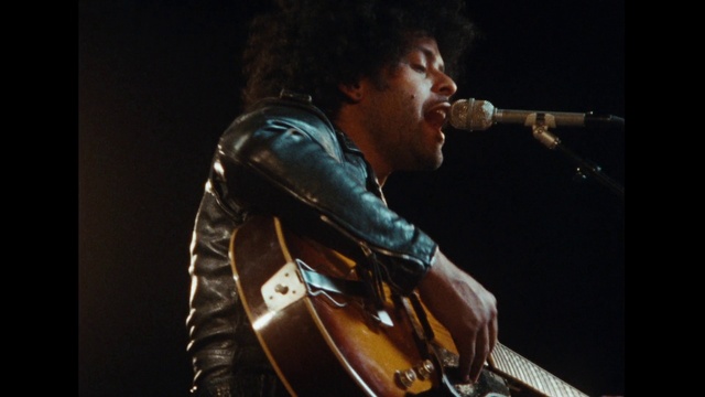 Video Reference: Microphone, Musical instrument, Guitar, String instrument, String instrument accessory, Concert, Guitar accessory, Guitarist, Human body, Musical instrument accessory