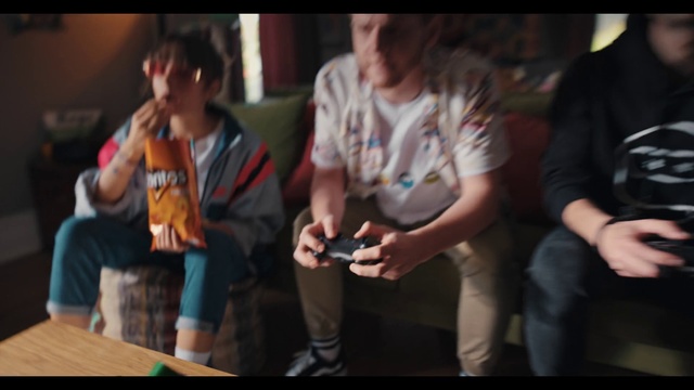 Video Reference: Shirt, Flash photography, T-shirt, Event, Fun, Table, Leisure, Recreation, Gadget, Sitting