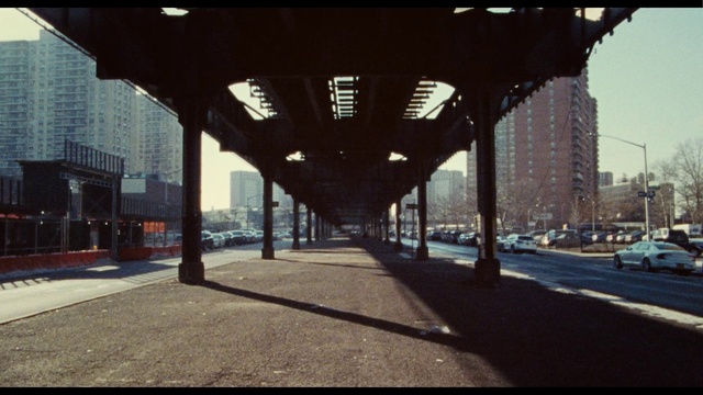 Video Reference: Building, Automotive lighting, Road surface, Shade, Asphalt, Thoroughfare, Urban design, Symmetry, Sidewalk, Tints and shades