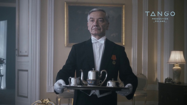 Video Reference: Tie, Microphone, Tableware, Door, Suit, Spokesperson, Dress shirt, Blazer, Picture frame, Serveware