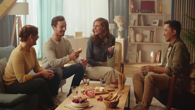 Video Reference: Smile, Photograph, Leg, Couch, Comfort, Tableware, Interior design, Sharing, Social group, Lamp