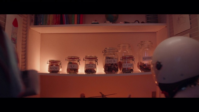 Video Reference: Automotive design, Shelf, Art, Font, Shelving, Display case, Space, Event, Visual arts, Eyewear