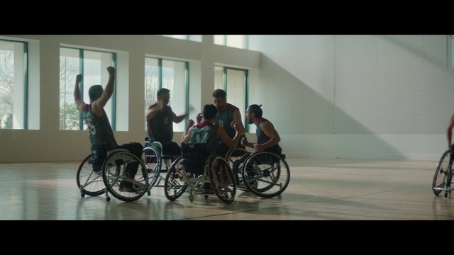 Video Reference: Wheelchair, Wheel, Tire, Wheelchair sports, Chair, Vehicle, Sports, Event, Bicycle wheel, Art