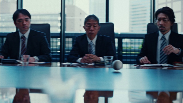 Video Reference: Coat, Table, Tie, Human, Suit, Social group, Conference room table, Chair, White-collar worker, Event