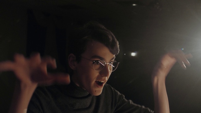 Video Reference: Glasses, Hand, Vision care, Flash photography, Gesture, Eyewear, Fun, Audio equipment, Midnight, T-shirt