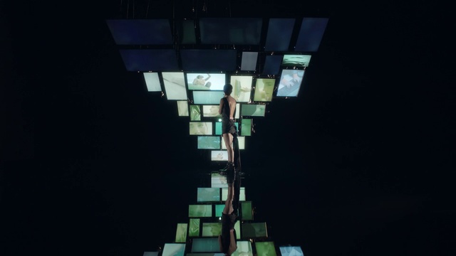 Video Reference: Rectangle, Tints and shades, Symmetry, Ceiling, Glass, Darkness, Skyscraper, Electric blue, Triangle, Facade