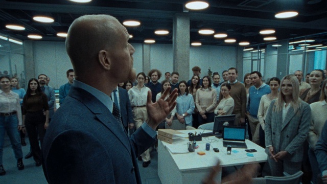 Video Reference: Outerwear, Coat, Table, Tie, Laptop, Chair, Computer, Suit, Desk, Engineering