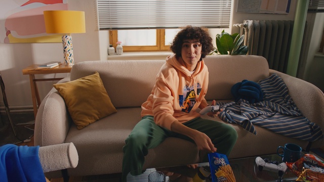 Video Reference: Couch, Plant, Comfort, Smile, Interior design, Lighting, Living room, Window, Window blind, studio couch