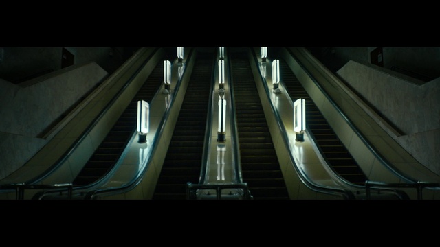 Video Reference: Escalator, Building, Stairs, Tints and shades, Parallel, Symmetry, City, Composite material, Metal, Darkness