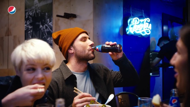Video Reference: Tableware, Product, Blue, Coat, Interaction, Alcoholic beverage, Bottle, Drink, Suit, Beard