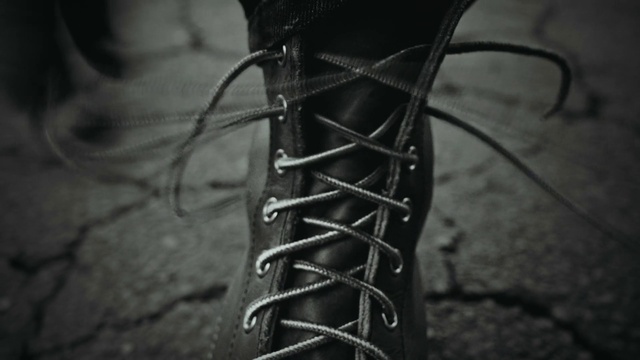 Video Reference: Shoe, Leg, Automotive tire, Human body, Synthetic rubber, Flash photography, Grey, Style, Knee, Bicycle part