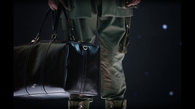 Video Reference: Shoe, Luggage and bags, Textile, Sleeve, Automotive lighting, Bag, Grey, Leather jacket, Shoulder bag, Blazer