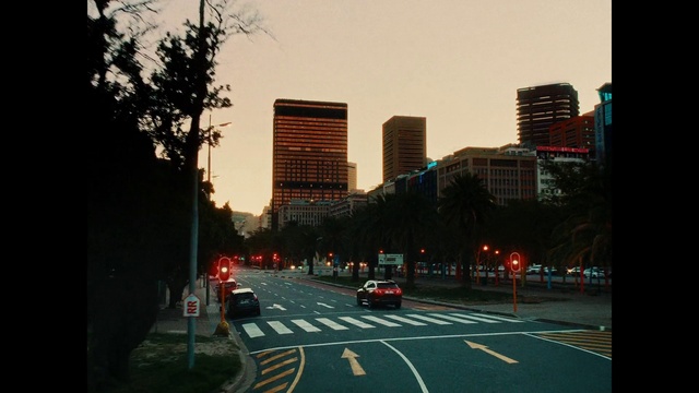 Video Reference: Building, Daytime, Skyscraper, Car, Sky, Infrastructure, Vehicle, Lighting, Thoroughfare, Tower block