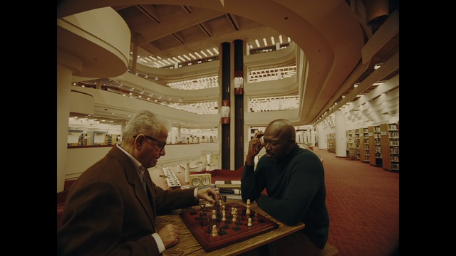 Video Reference: Table, Chess, Chessboard, Eyewear, Indoor games and sports, Sports equipment, Board game, Suit, Tabletop game, Event