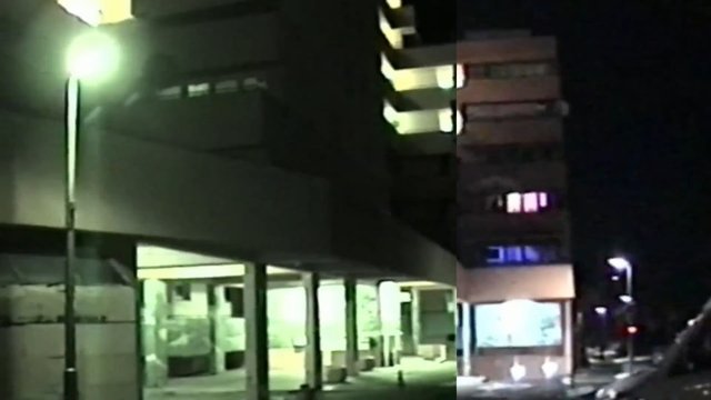 Video Reference: night, building, exterior, streetlight, apartment, office, urban, dark, windows, parking, lowlight, street, architecture