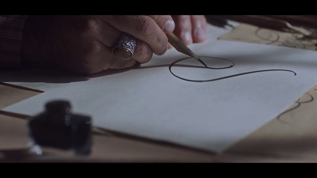 Video Reference: Table, Office supplies, Gesture, Wood, Finger, Automotive design, Writing implement, Thumb, Nail, Writing instrument accessory