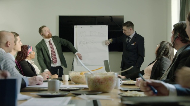 Video Reference: Table, Tableware, Coat, Suit, Desk, Whiteboard, Tie, Event, Plate, Job