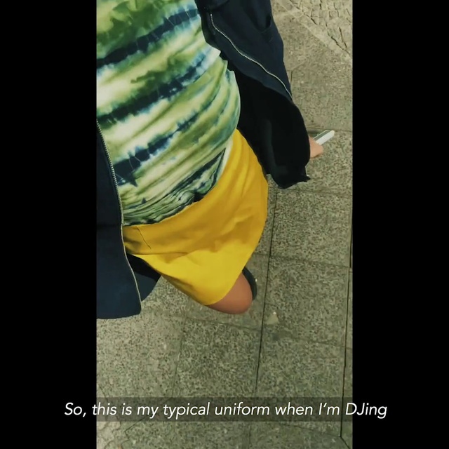Video Reference: Dress, Human body, Sleeve, Plant, Jacket, Thigh, Street fashion, Knee, Road surface, Tints and shades