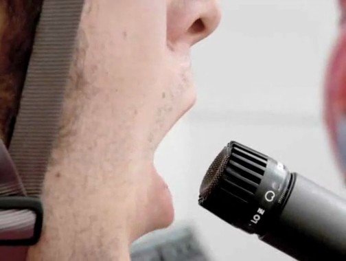 Video Reference: close-up, microphone, speaking, mouth, side profile, audio, speech, performance, interview, voice, broadcast