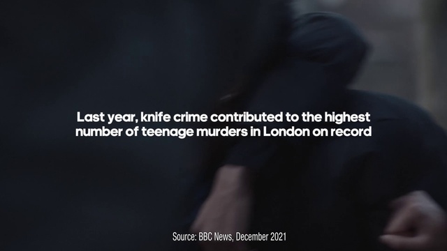 Video Reference: Gesture, Font, Electric blue, Darkness, Brand, Logo, Photo caption, Circle, Multimedia, Vehicle door