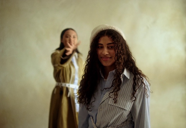 Video Reference: Outerwear, Shoulder, Flash photography, Sleeve, People in nature, Gesture, Happy, Street fashion, Fashion design, Long hair