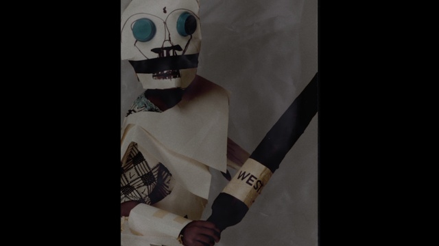 Video Reference: Sleeve, Sports gear, Gesture, T-shirt, Street fashion, Font, Personal protective equipment, Art, Chest, Cross