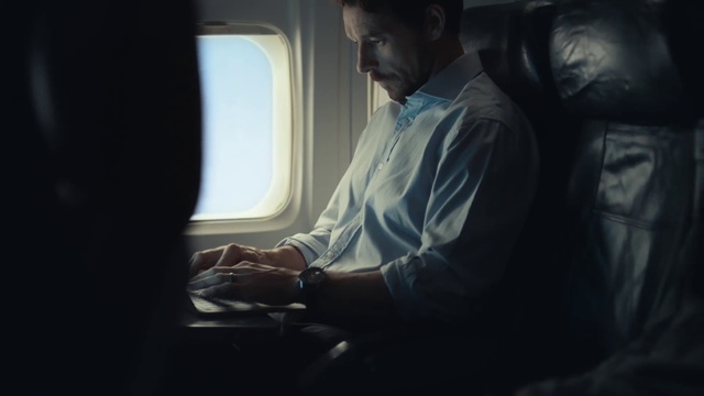 Video Reference: Watch, Flash photography, Sleeve, Gesture, Aircraft, Aerospace manufacturer, Elbow, Air travel, Airplane, Darkness