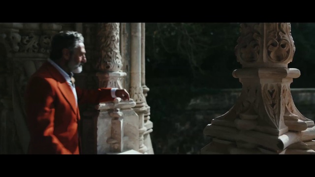 Video Reference: Flash photography, Temple, Standing, Gesture, Font, Formal wear, Event, Suit, Art, Darkness