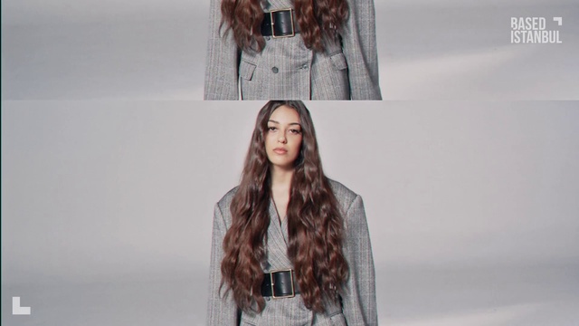 Video Reference: Hair, Joint, Lip, Outerwear, Hairstyle, Shoulder, Street fashion, Neck, Fashion, Textile