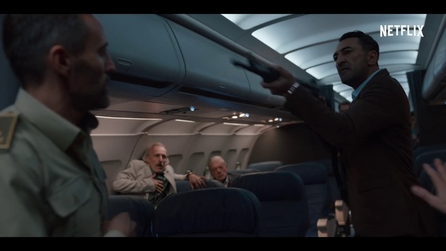 Video Reference: Outerwear, Automotive design, Coat, Gesture, Air travel, Collar, Flash photography, Aerospace manufacturer, Passenger, Vehicle