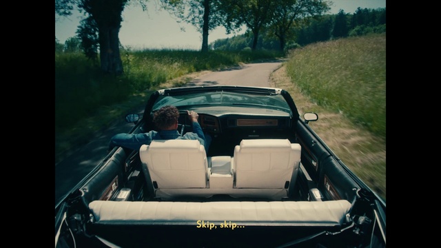 Video Reference: Plant, Vehicle, Tire, Hood, Sky, Motor vehicle, Car, Automotive lighting, Tree, Automotive design