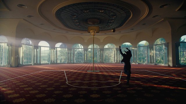 Video Reference: indoor court, basketball, silhouette, jump shot, empty room, arched windows, sunlight, sports, ceiling dome, recreation, athletic, architecture, wide angle, dramatic lighting
