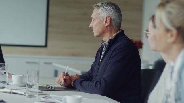 Video Reference: Table, Coat, Tableware, Gesture, Suit, White-collar worker, Event, Job, Employment, Official