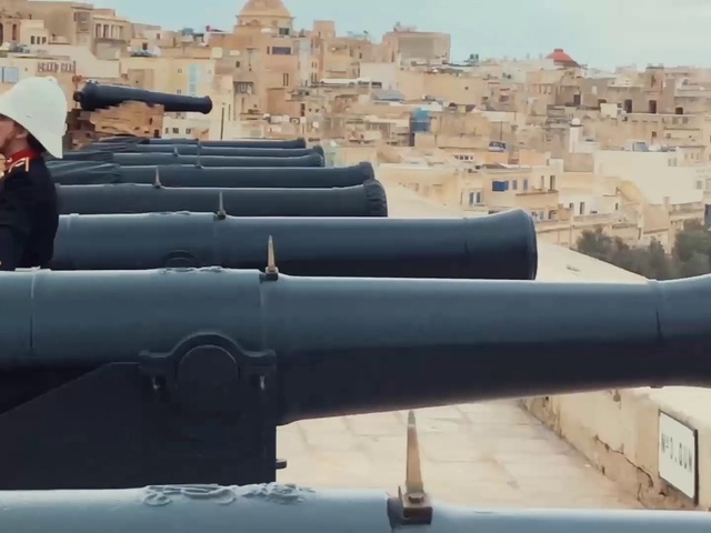 Video Reference: Sky, Travel, Cannon, Landscape, Roof, Building, Pipe, Automotive exterior, Hat, Luxury vehicle