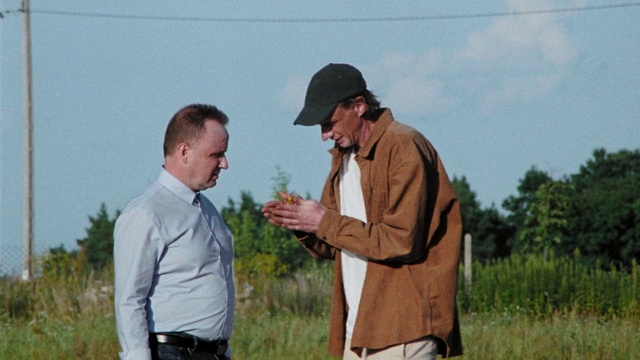 Video Reference: Clothing, Plant, Sky, Shirt, Cap, Natural environment, Sleeve, Dress shirt, Tree, Gesture