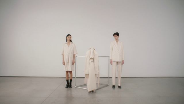 Video Reference: Suit trousers, Sleeve, Fashion design, Art, Event, Collar, Uniform, Visual arts, Performance, Formal wear