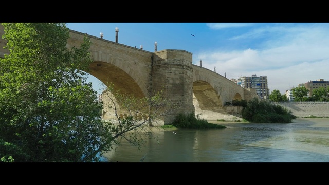 Video Reference: Water, Building, Sky, Cloud, Tree, Natural landscape, Plant, Arch bridge, Bridge, Aqueduct