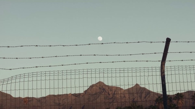Video Reference: Sky, Ecoregion, Fence, Wire fencing, Atmospheric phenomenon, Electricity, Landscape, Barbed wire, Horizon, Moon