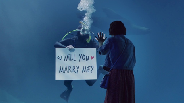 Video Reference: World, Sky, Gesture, Electric blue, Event, Font, Job, T-shirt, Advertising, Signage