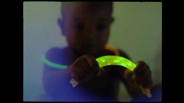 Video Reference: Gesture, Reptile, Electronic device, Toddler, Happy, Gadget, Display device, Font, Natural foods, Electric blue