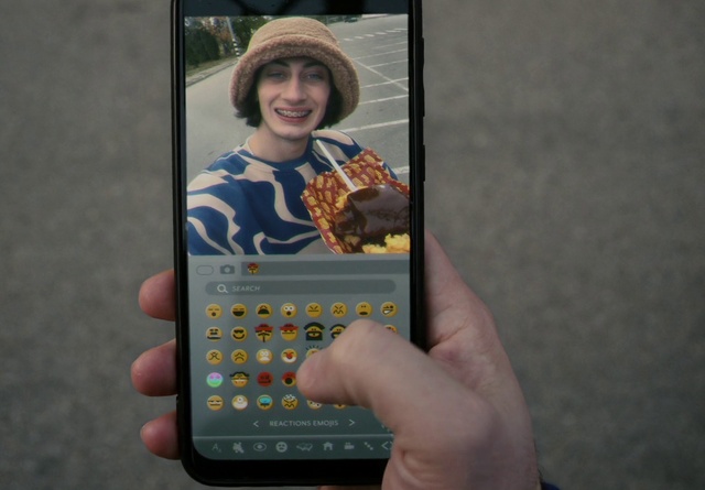 Video Reference: Smile, Hat, Mobile phone, Telephony, Fedora, Communication Device, Sun hat, Gesture, Portable communications device, Mobile device