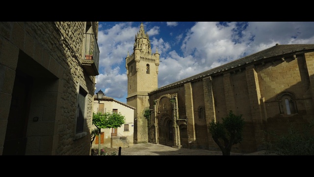 Video Reference: Cloud, Sky, Plant, Building, House, Tints and shades, Facade, Road surface, Tower, City