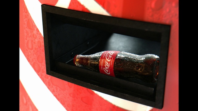 Video Reference: Automotive lighting, Automotive design, Drink, Font, Tints and shades, Rectangle, Carbonated soft drinks, Automotive exterior, Vehicle door, Bottle