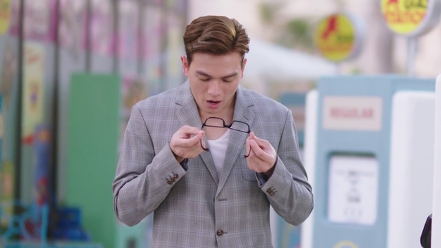 Video Reference: Clothing, Mobile phone, Coat, Gesture, Communication Device, Blazer, Gadget, Street fashion, Electronic device, Portable communications device